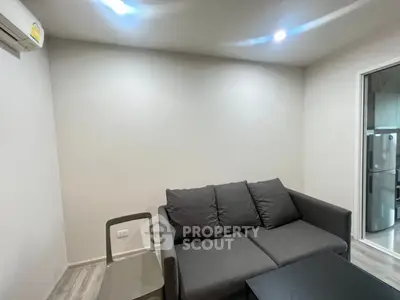 Modern living room with gray sofa and sleek design