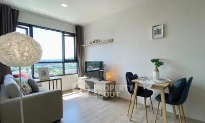 Modern living room with stylish decor and city view, featuring cozy seating and dining area.