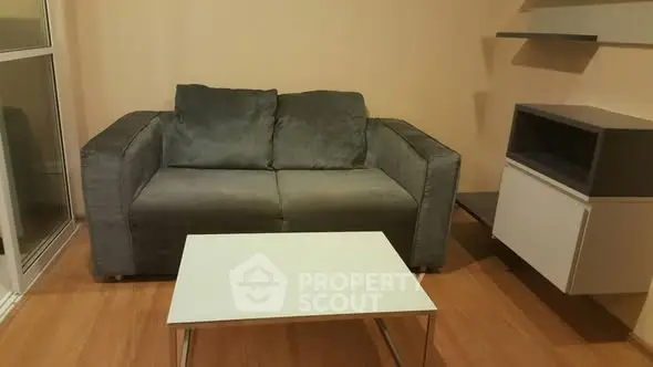 Cozy living room with modern gray sofa and sleek white coffee table