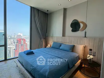 Luxurious bedroom with stunning city view and modern decor
