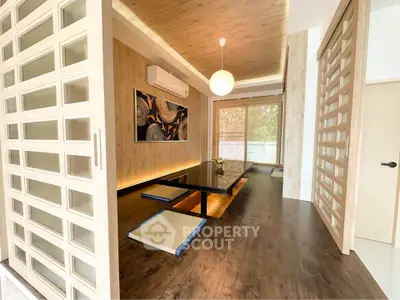 Elegant Japanese-style room with tatami mats and modern decor, perfect for serene living.