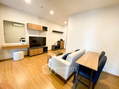 Modern living room with stylish furniture and wooden flooring