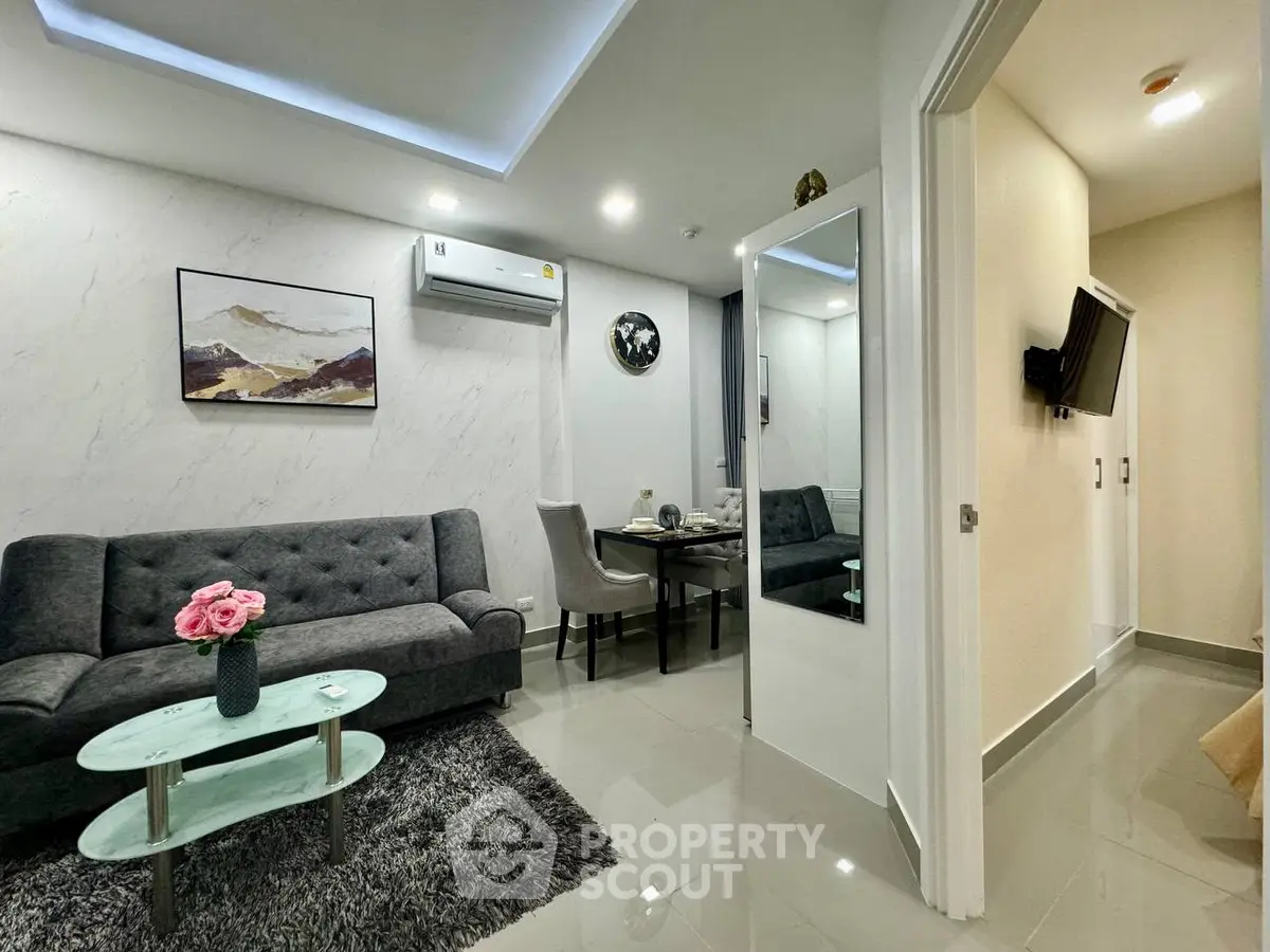 Modern living room with sleek furniture and stylish decor in a contemporary apartment.