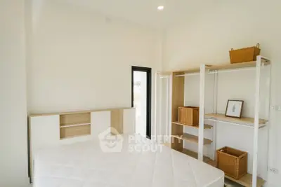 Spacious bedroom with minimalist design and ample storage space