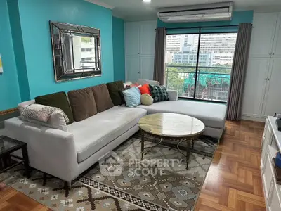 Spacious living room with modern decor and large window view
