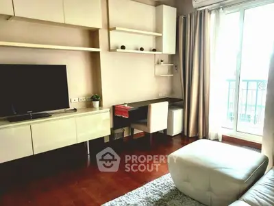 Modern living room with sleek furniture and balcony access, perfect for urban living.