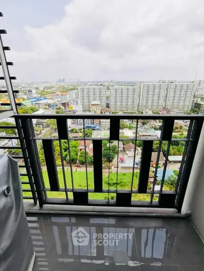 Stunning cityscape view from a modern balcony with sleek railing design.
