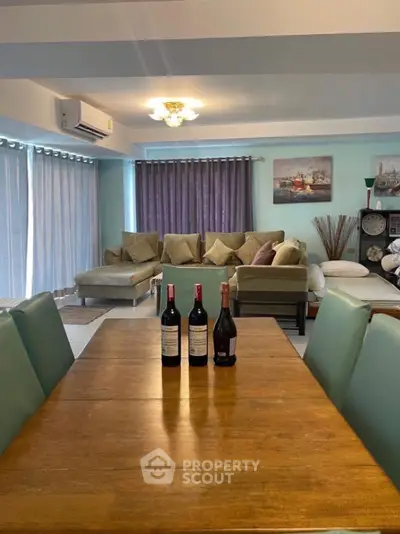 Spacious living room with elegant decor and ample natural light