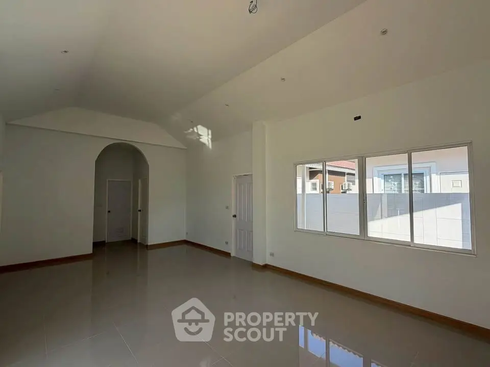 Spacious and bright interior with high ceilings and large windows