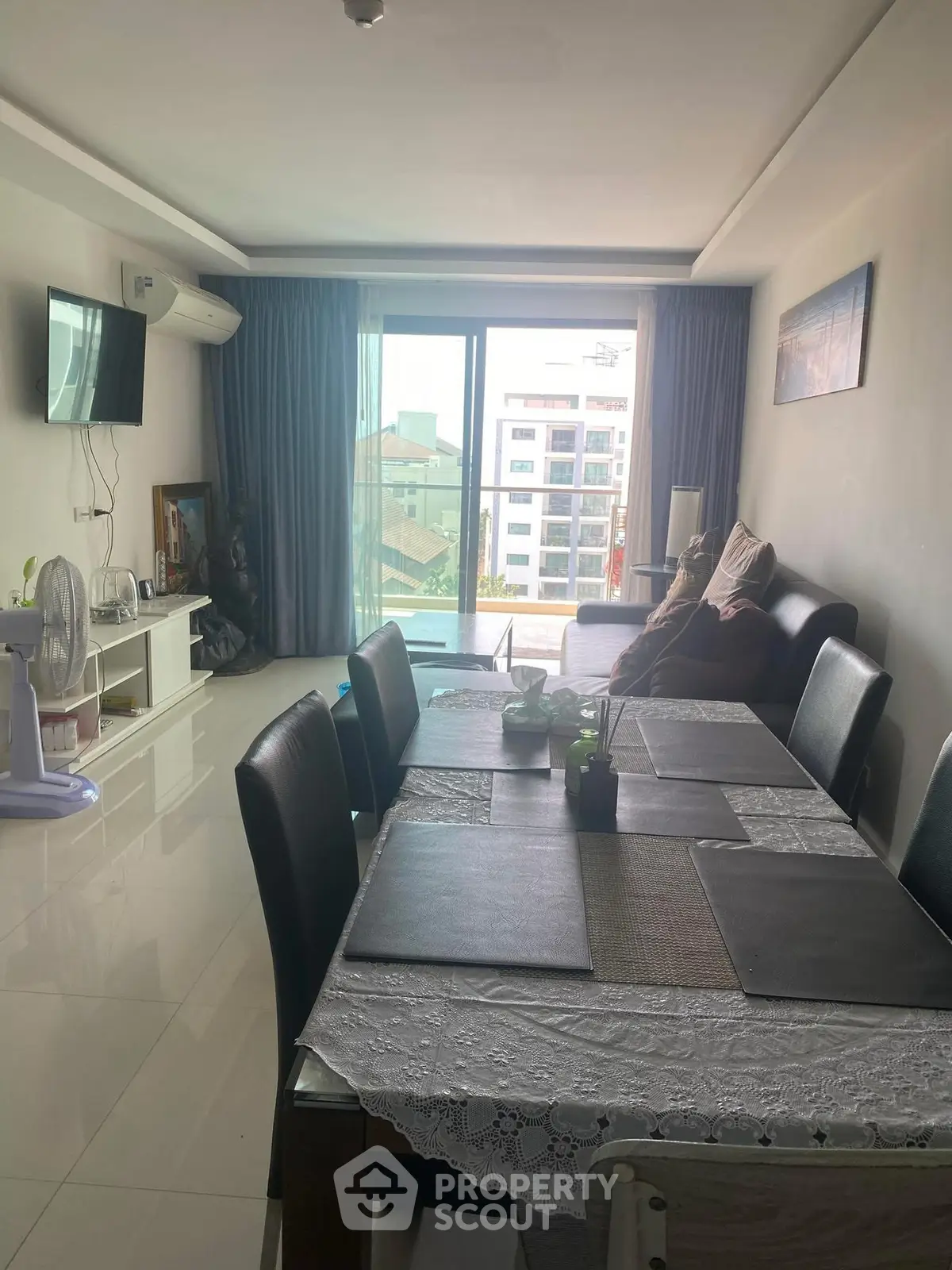 Spacious living room with modern decor and large window view