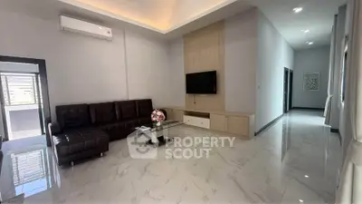 Spacious modern living room with sleek design and marble flooring