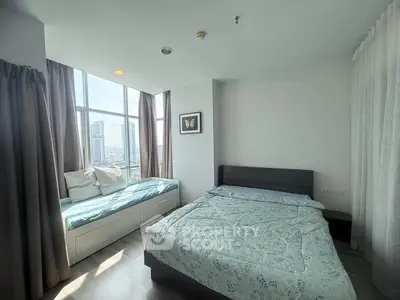 Bright bedroom with city view and cozy window seat in modern apartment