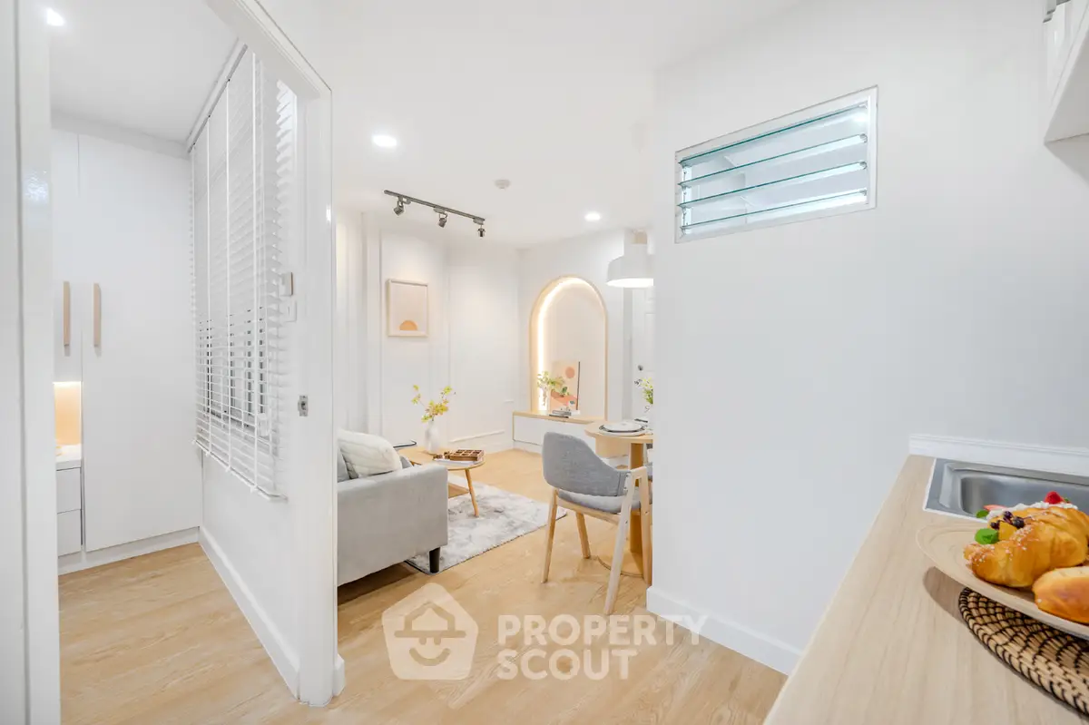 Modern open-plan living and dining area with stylish decor and natural light.