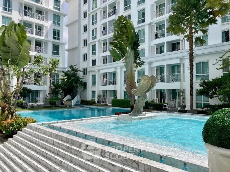Luxurious condominium with stunning pool and lush greenery, perfect for modern living.