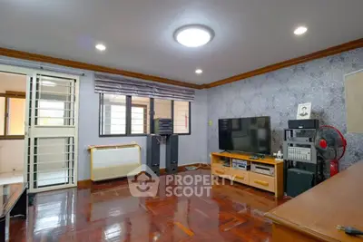 Spacious living room with modern decor and entertainment setup