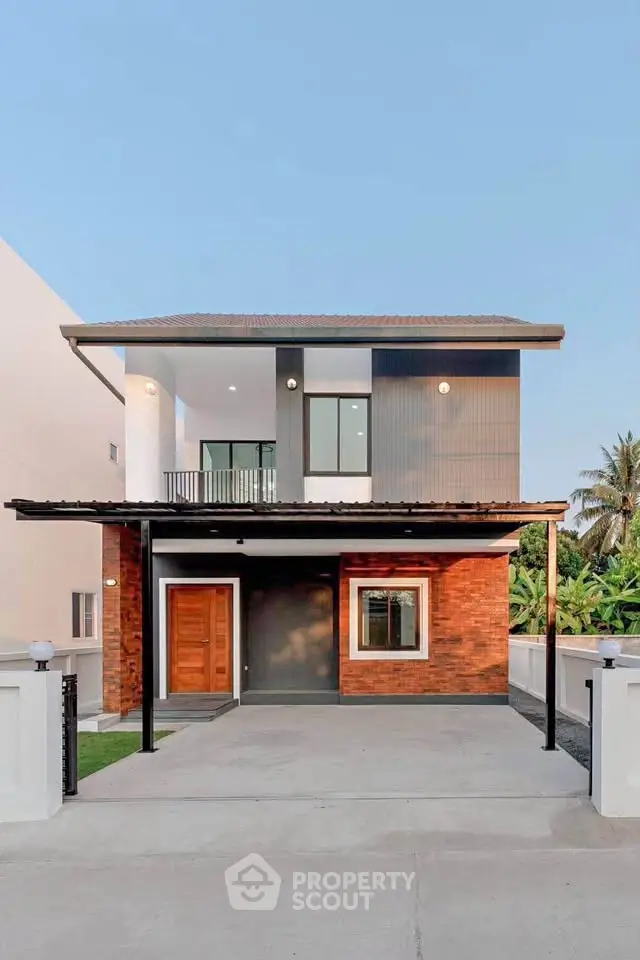 Modern two-story house with sleek design and spacious driveway