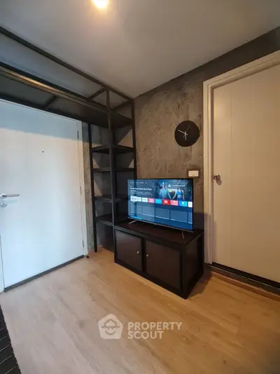 Modern living room with sleek TV stand and stylish shelving unit