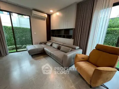 Modern living room with sleek furniture and garden view