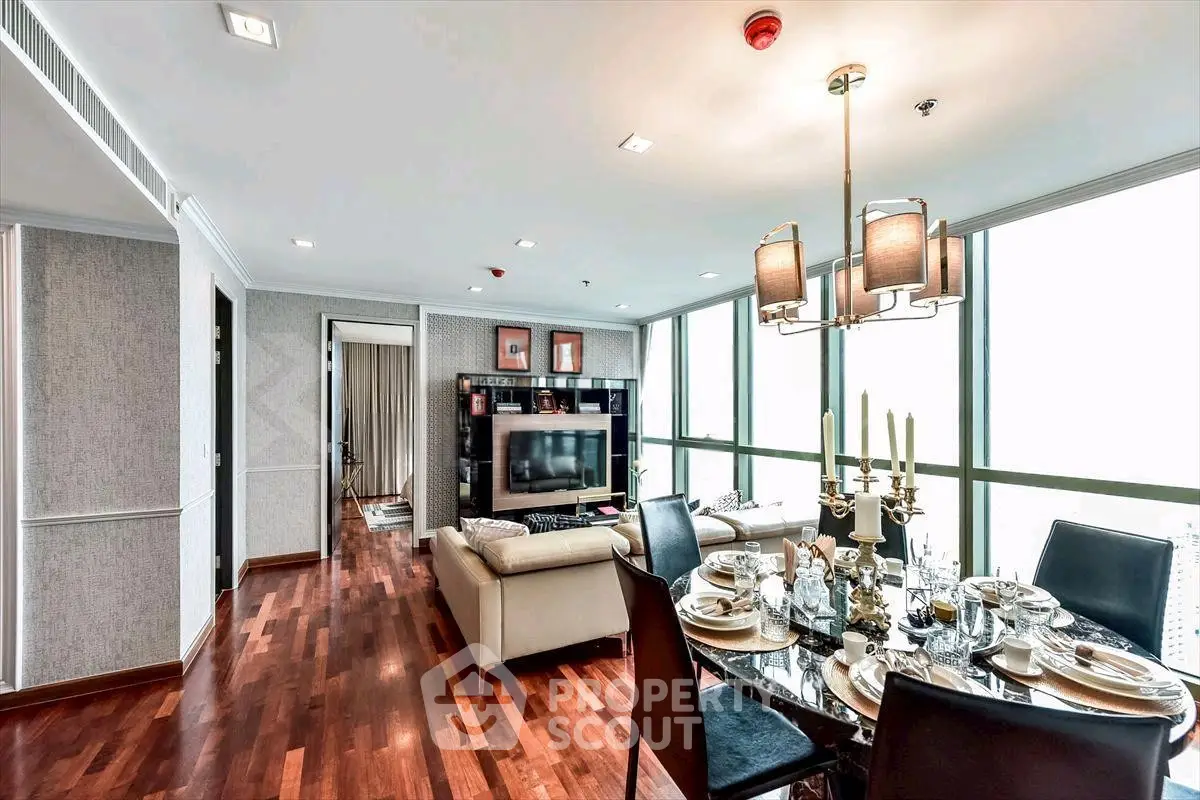Luxurious living room with elegant dining area and large windows offering stunning views.