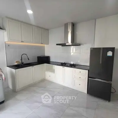 Modern kitchen with sleek cabinetry and stainless steel appliances