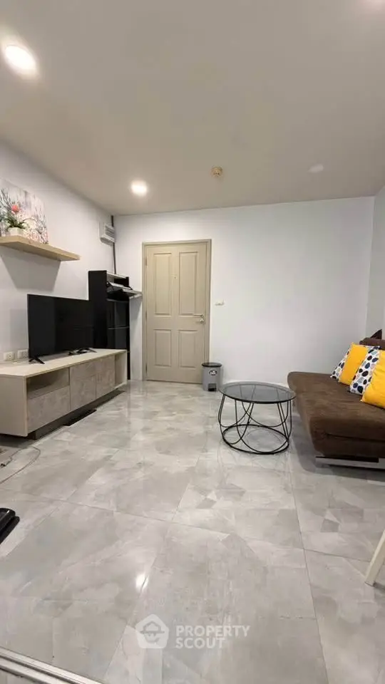 Modern living room with sleek furniture and stylish decor, perfect for relaxation and entertainment.