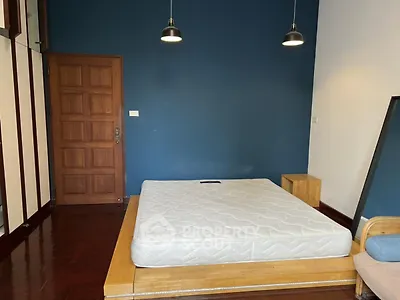 Spacious bedroom with modern design and wooden accents