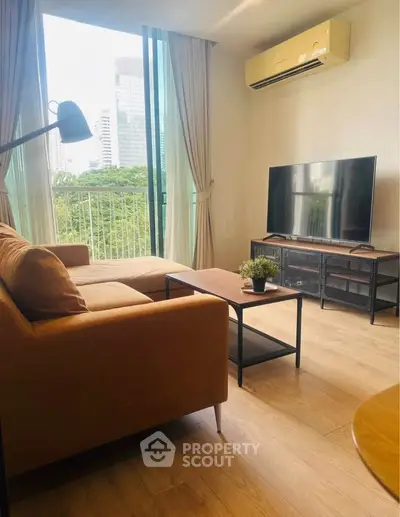 Modern living room with large window, stylish furniture, and city view balcony.