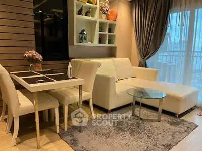 Modern living room with elegant decor, cozy sofa, and dining area in a stylish apartment.