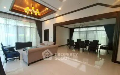 Spacious living and dining area with elegant decor and large windows