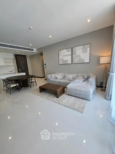 Modern living room with sleek design and open kitchen layout