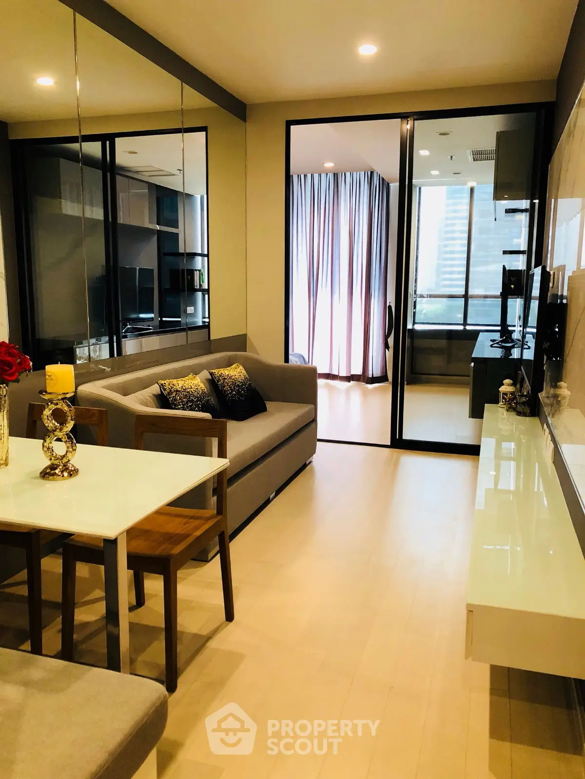 Modern living room with sleek design and open layout, featuring elegant decor and ample natural light.