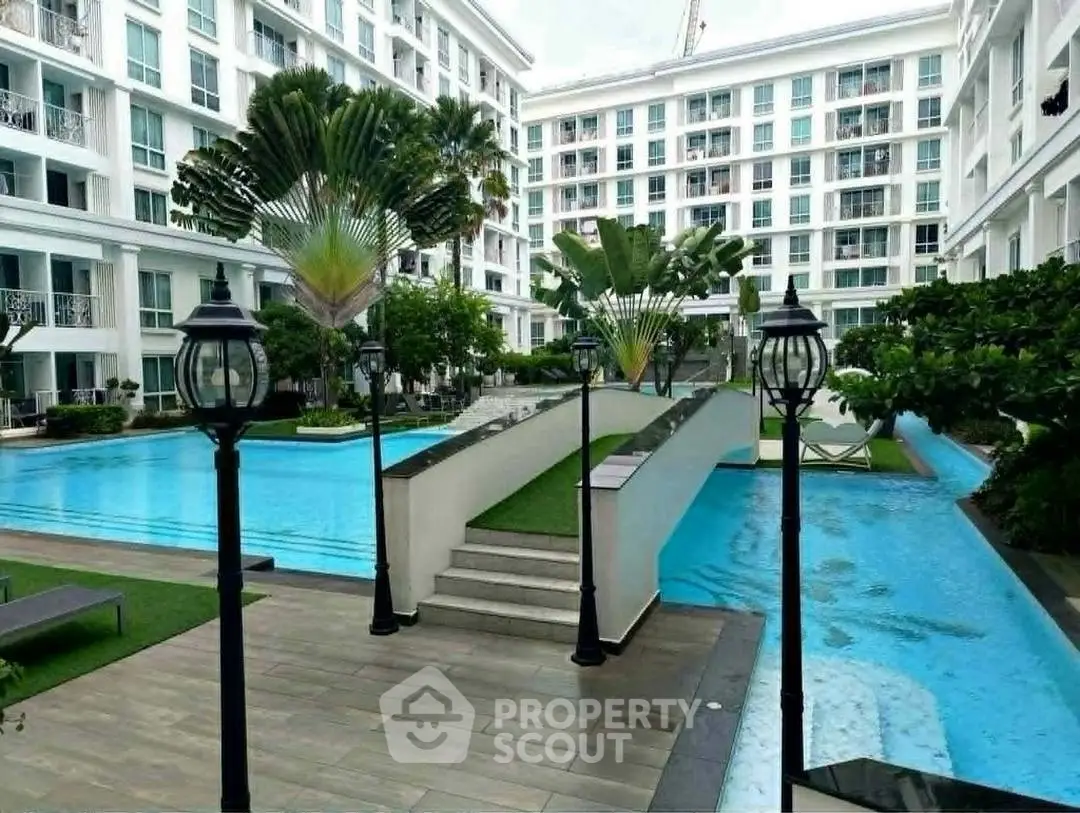 Luxurious apartment complex with stunning pool and lush landscaping
