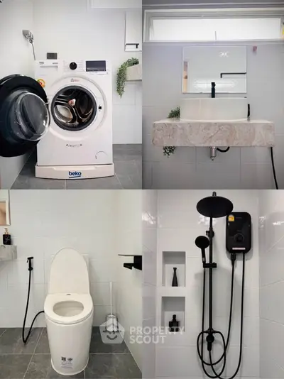 Modern bathroom with washing machine, sleek fixtures, and elegant shower design.