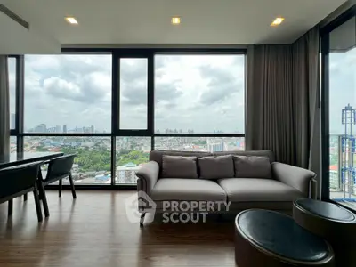 Modern living room with panoramic city view and stylish furniture