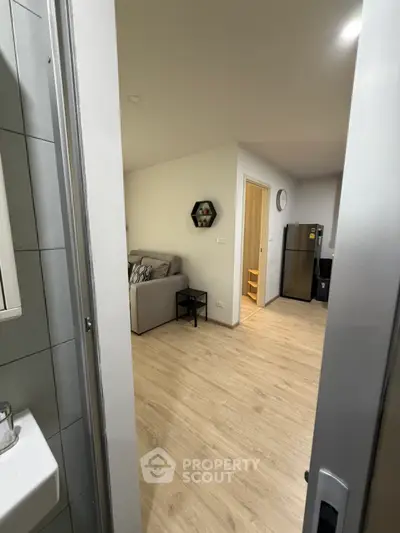 Modern apartment interior with cozy living room and kitchen view