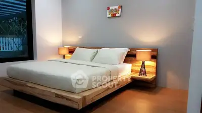 Modern bedroom with stylish wooden bed and ambient lighting