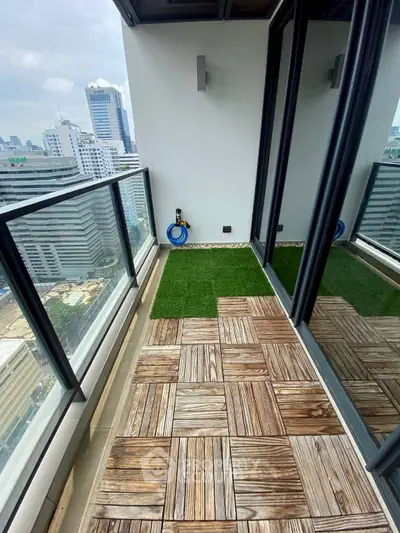 Stunning high-rise balcony with city views and stylish wooden flooring.