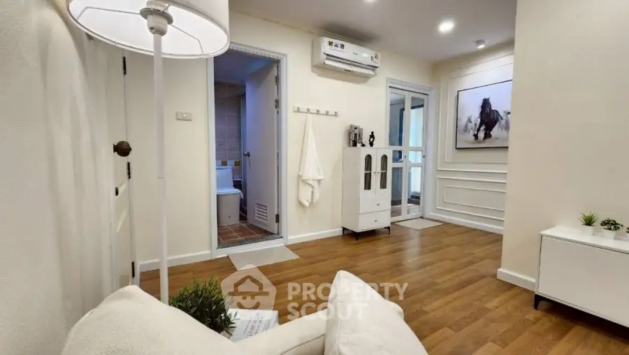 Modern living room with wooden flooring and stylish decor