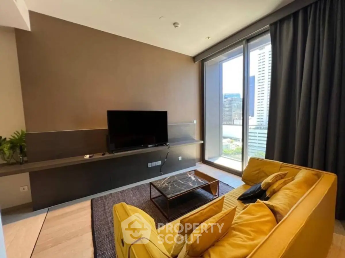 Modern living room with yellow sofa and city view through large windows