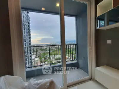 Stunning high-rise balcony view with expansive cityscape and lush greenery.
