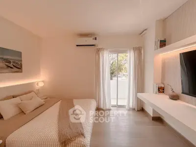 Modern bedroom with balcony access and stylish decor