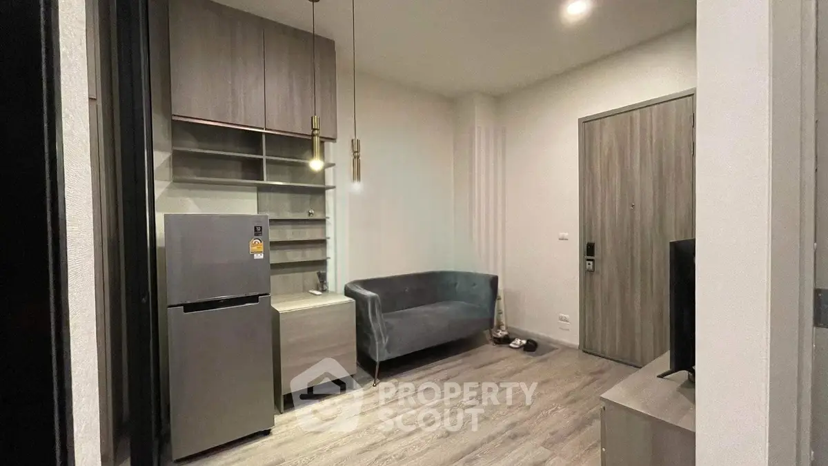 Modern living room with sleek furniture and stylish lighting in a contemporary apartment.