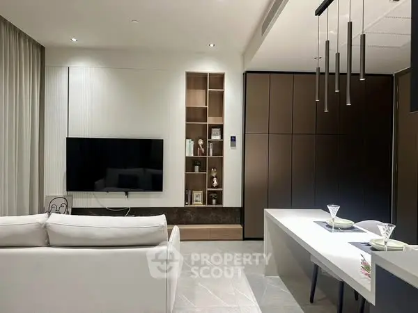 Modern living room with sleek design and integrated storage solutions.
