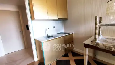 Stylish compact kitchen with modern cabinetry and sleek design