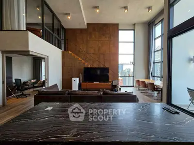Luxurious modern living room with high ceilings and city view