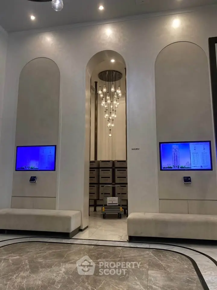 Elegant building lobby with modern lighting and digital displays