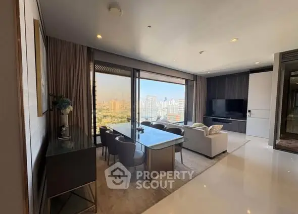 Luxurious living room with city view, modern furniture, and elegant decor.