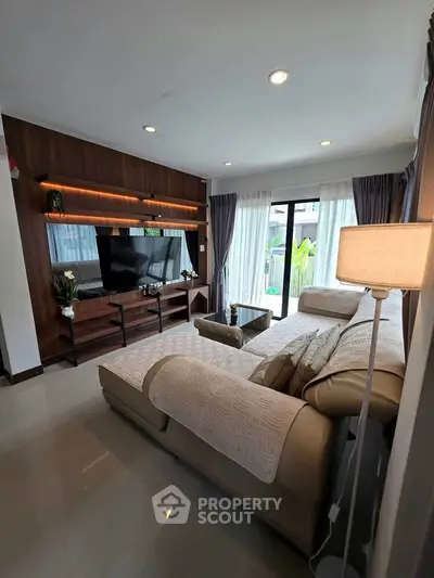 Spacious modern living room with elegant decor and large windows for natural light.