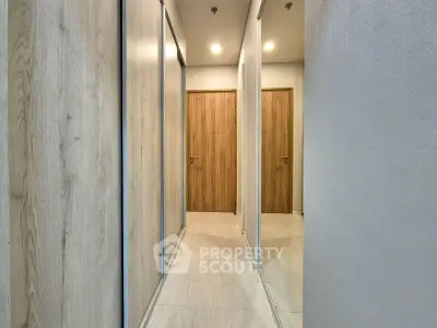 Modern hallway with wooden doors and sleek design