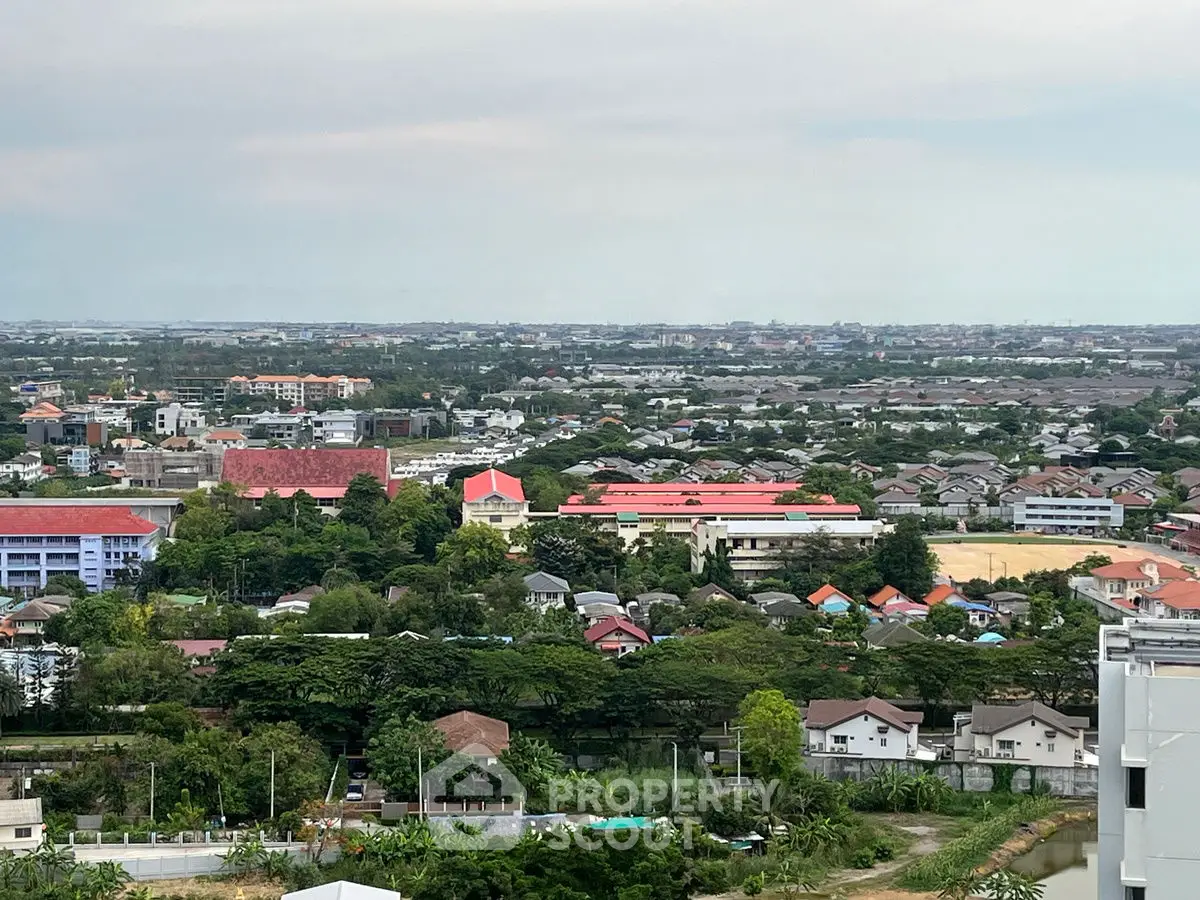 Stunning panoramic view of suburban landscape with lush greenery and distant cityscape.